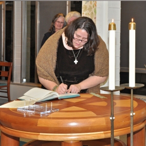 Signing my final profession of vows in our community vow book
